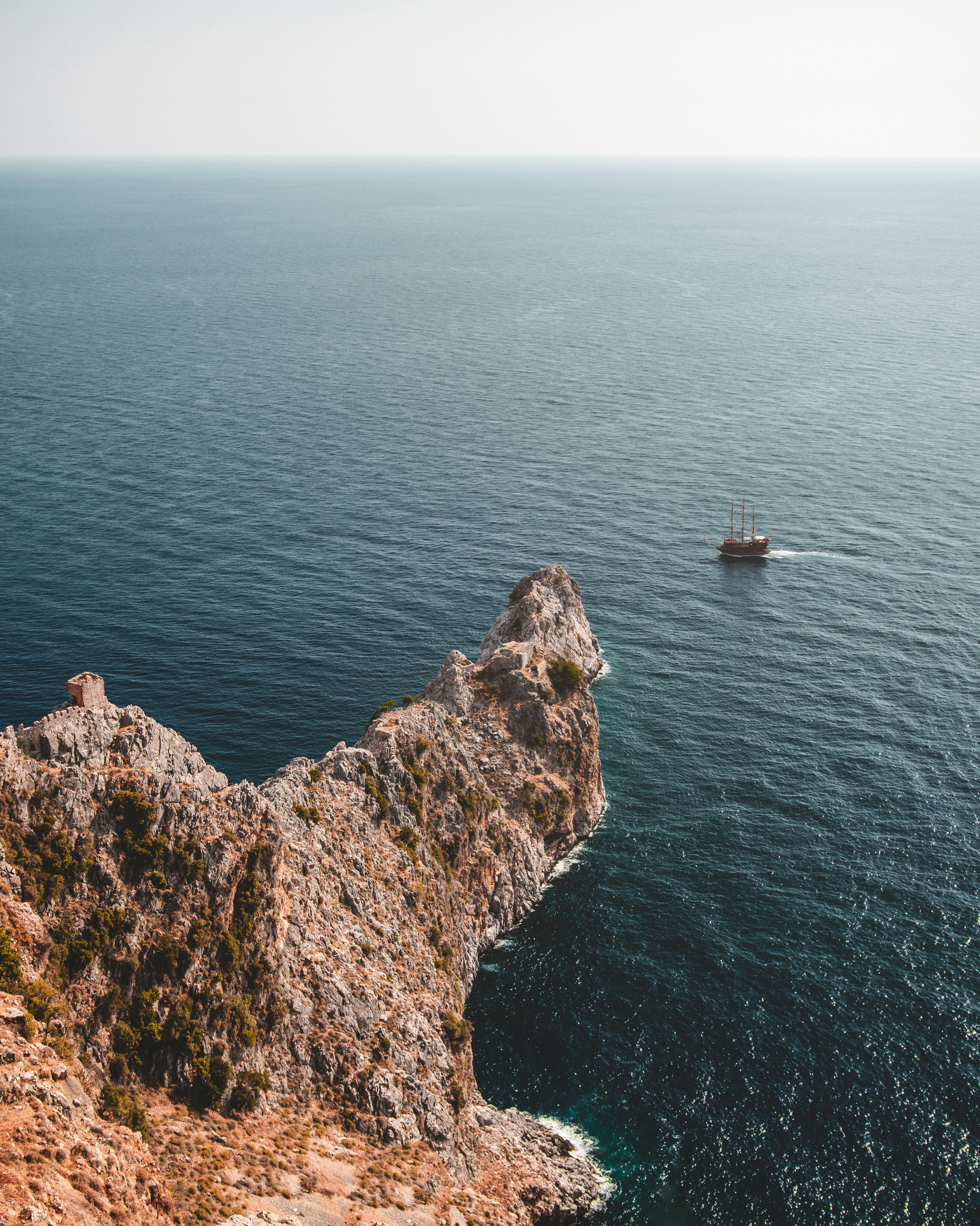 boat on blue body of water during daytime